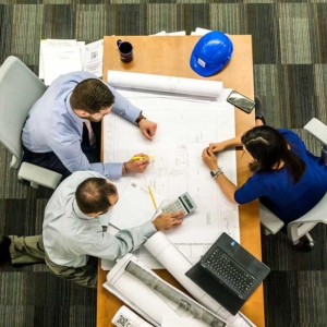 Arial group photo of three working on a project