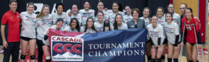 Women's volleyball team holding Cascade conference tournament champions banner